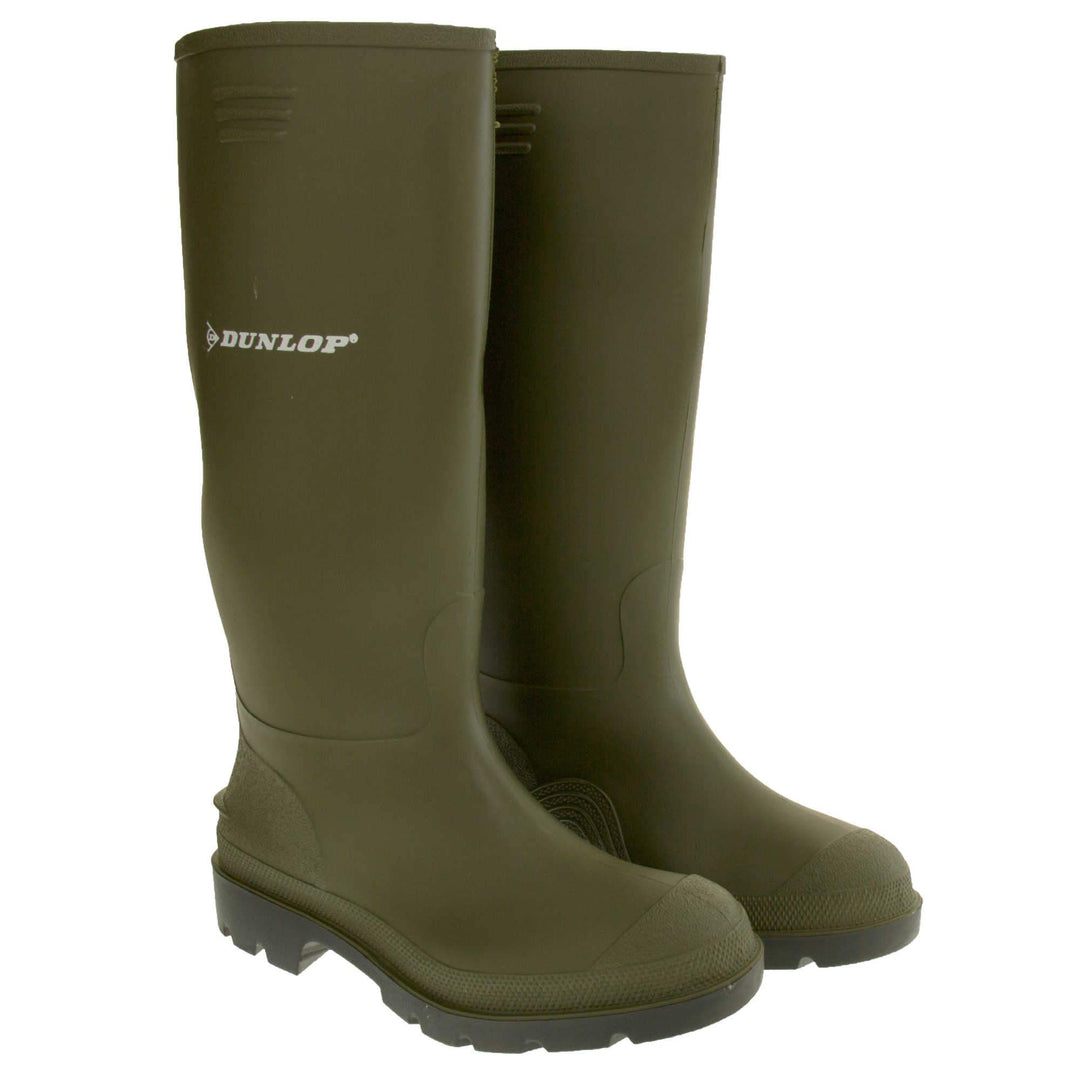 Dunlop wellington boots. Green knee high wellies with a waterproof rubber upper and sole. With white Dunlop logo and brand on the side. Both feet together at an angle.