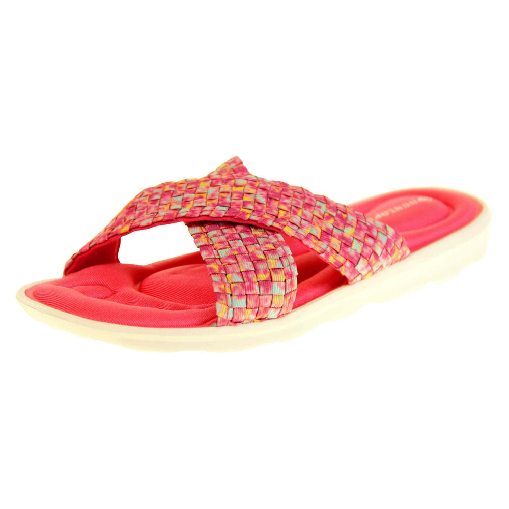 Pink sandals for women - Hot pink mosaic style crossover sandals with memory foam insole, white low heel flat outsole in a flip flop design. Left foot at an angle.