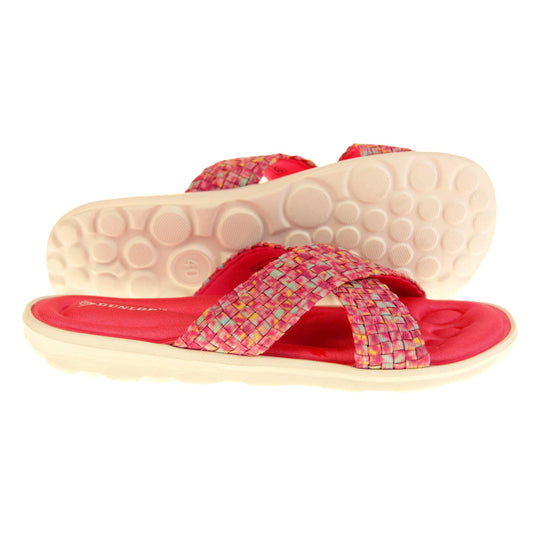 Pink sandals for women - Hot pink mosaic style crossover sandals with memory foam insole, white low heel flat outsole in a flip flop design. Right foot side-on, left foot showing circular outsole treds.