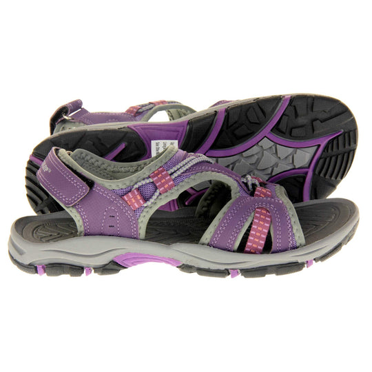 Womens Dunlop Hiking Sandals - Plum purple faux leather upper with light purple mesh and grey elasticated strap detailing around. Good grips to the sole and a hook and loop ankle strap for a secure fit. Grey, purple and black flexible outsole. Right foot side view, left foot on side showing deep grips to sole.