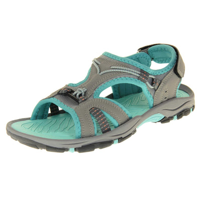 Dunlop womens walking sandals - Light grey faux leather upper with decorative elasticated strap detailing and teal blue trim. Hook and loop touch fastening ankle strap for secure fitting. Turquoise padded insole for extra comfort and a teal, grey and black flexible outsole with good grips for hiking. Left foot angled view.