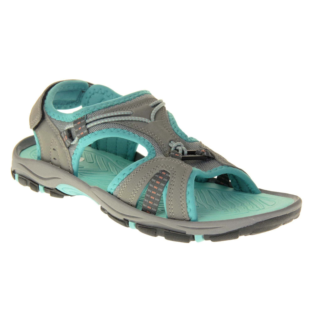 Dunlop womens walking sandals - Light grey faux leather upper with decorative elasticated strap detailing and teal blue trim. Hook and loop touch fastening ankle strap for secure fitting. Turquoise padded insole for extra comfort and a teal, grey and black flexible outsole with good grips for hiking. Right foot angled view.
