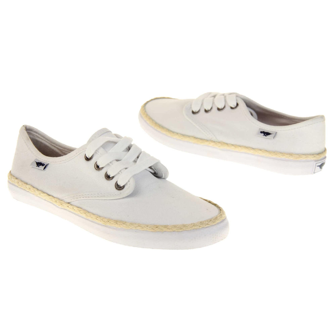 Espadrille pumps. Sneaker style shoes with a white canvas upper. White laces and a small Rocket Dog label to the side. White outsole with espadrille rope around the top. Both feet at an angle facing top to tail.