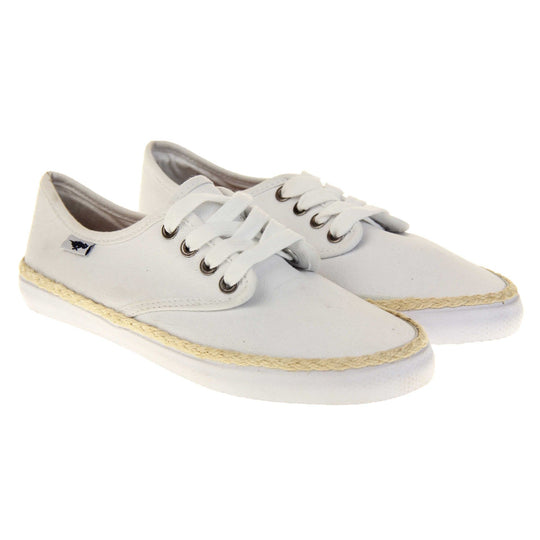 Espadrille pumps. Sneaker style shoes with a white canvas upper. White laces and a small Rocket Dog label to the side. White outsole with espadrille rope around the top. Both feet together at a slight angle.