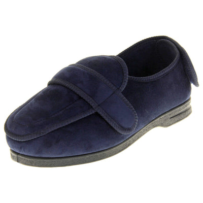 Extra wide fit slippers for men. Full back slippers with navy blue upper. Adjustable touch fasten strap to the top of the foot and around the back of the heel. Navy textile lining. Firm black sole. Left foot at an angle.