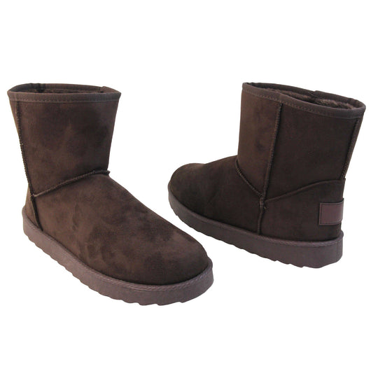 Faux fur lined boots. Ankle boots with a dark brown faux suede upper and stitching detail. Brown faux fur lining. Chunky brown sole with deep tread to the bottom. Both feet from a slight angle facing top to tail.