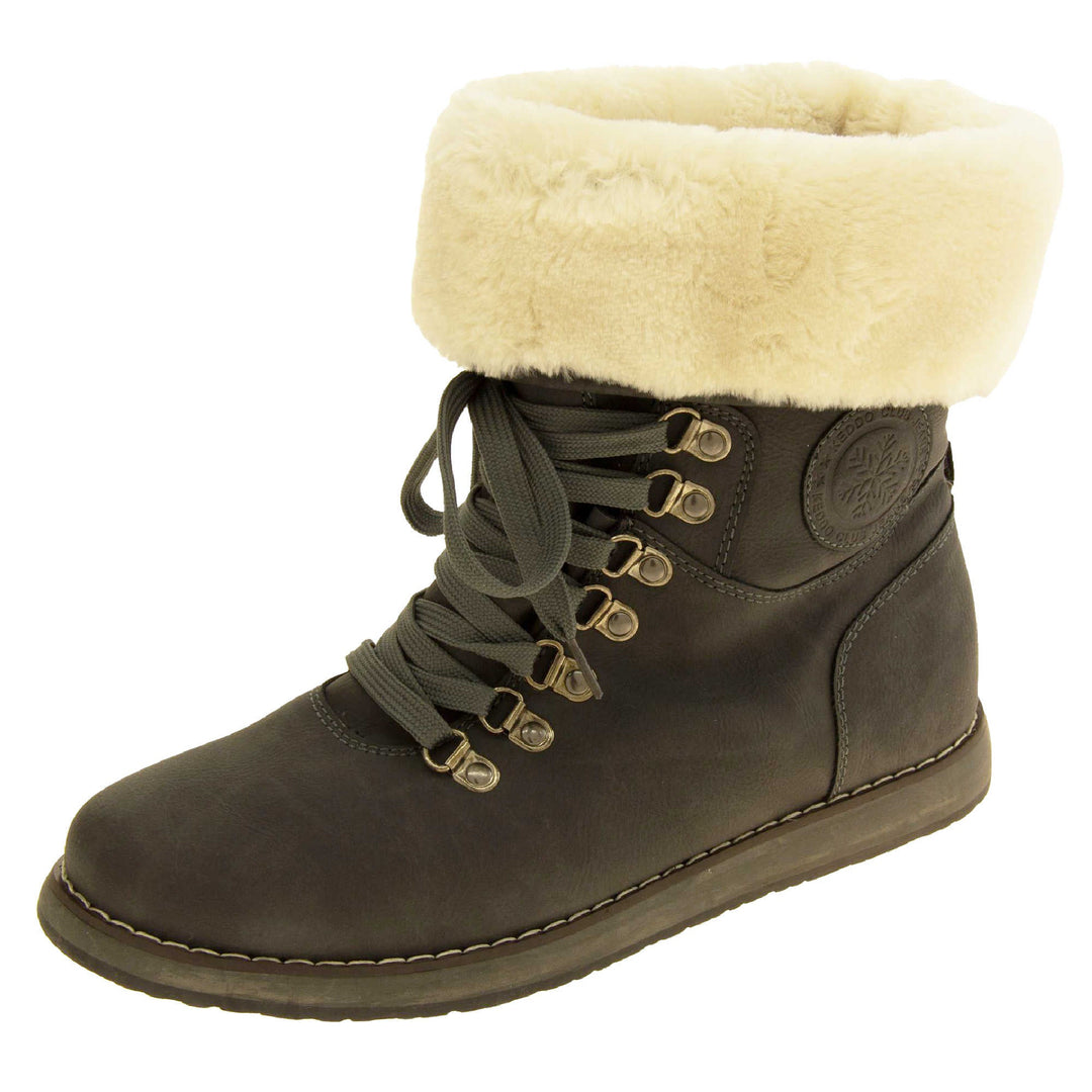 Faux fur lined winter boot. Women's boot in an ankle style with a grey faux suede upper. Pull on design with grey faux laces detail to the front. Cream faux fur lining and collar. Grey sole with grip to the bottom. Left foot at an angle.