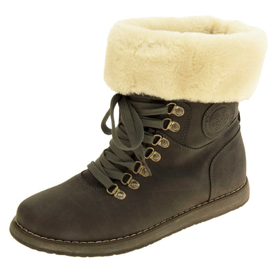 Faux fur lined winter boot. Women's boot in an ankle style with a grey faux suede upper. Pull on design with grey faux laces detail to the front. Cream faux fur lining and collar. Grey sole with grip to the bottom. Left foot at an angle.