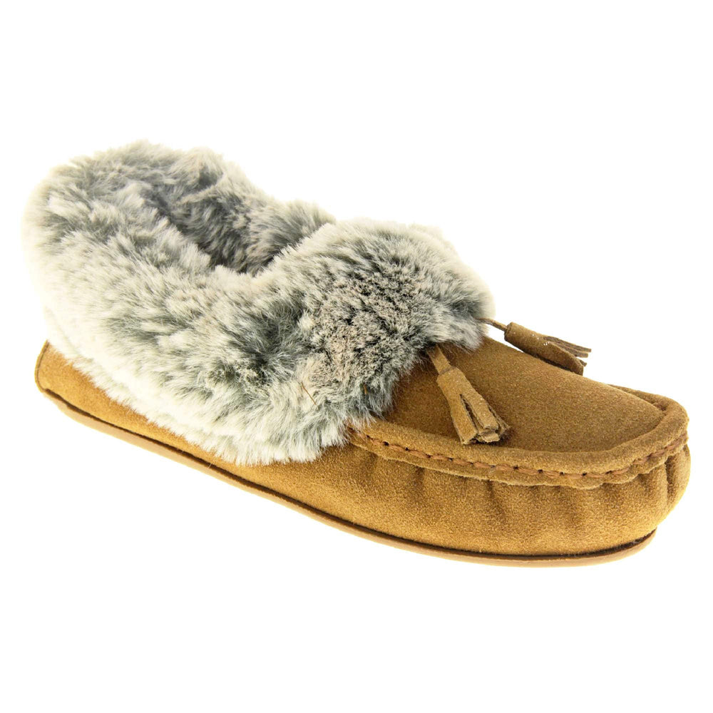 Faux fur moccasin slippers. Womens brown faux suede moccasin style slippers. With stitched detailing and tassels with subtle glitter on. Pale grey faux fur collar and lining. Brown firm sole. Right foot at an angle.
