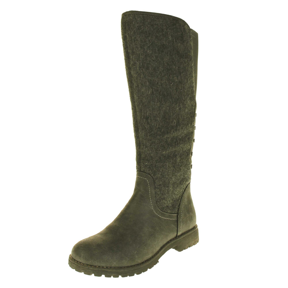 Faux suede knee high boots. Tall boots with a grey faux nubuck leather and felt upper with an elastic panel and decorative laces to the back. Stitching detailing around the outsole and the ankle. Full length zip to the inside leg. Left foot at an angle.