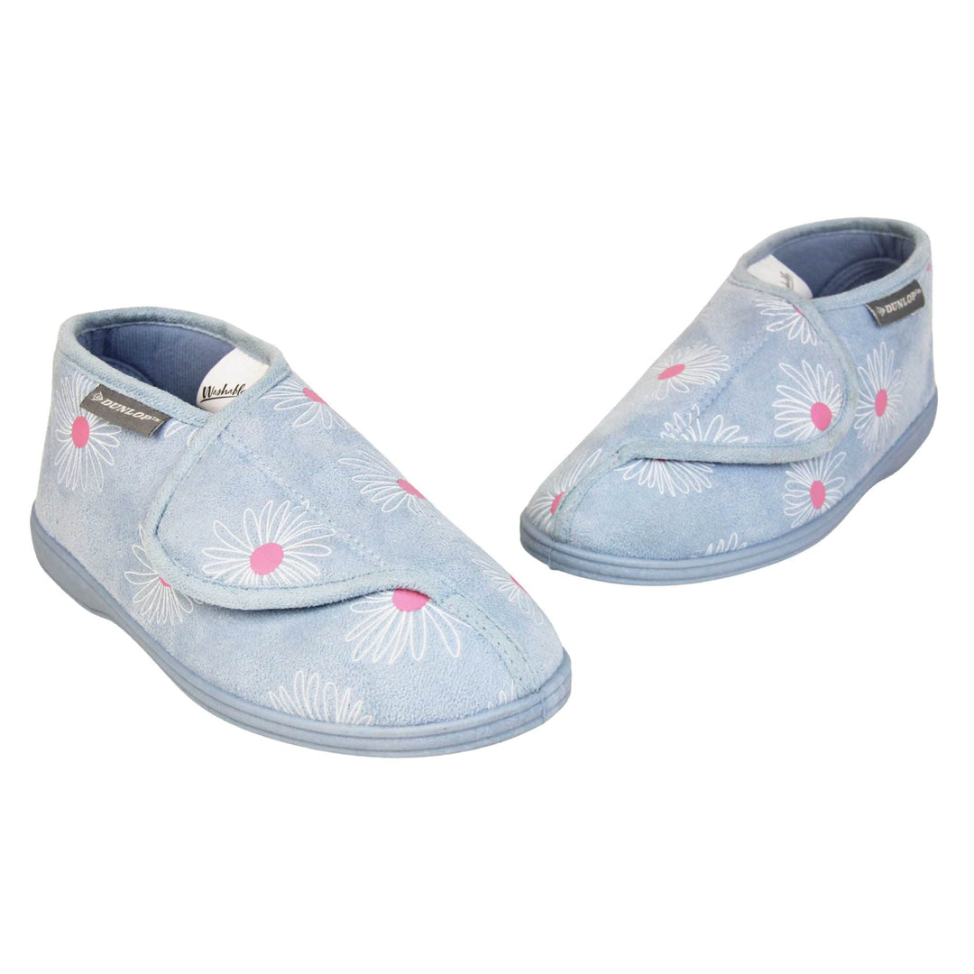 Flower slippers. Womens bootie style slipper with a pale blue textile upper with a white and pink flower print. Touch fasten tab to the top and blue textile lining. Firm blue sole. Both feet in a v shape with the toes almost touching.