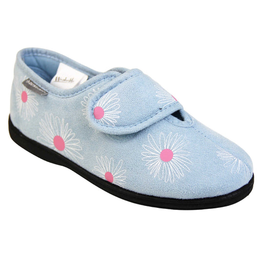 Flower slippers. Womens full back slipper. Pale blue upper with white daisy design and bright pink for the middle of the flowers. Touch fasten strap over the top of the foot to adjust the fit. Matching blue textile lining and firm black sole. Right foot at an angle.