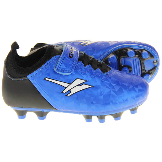 Kids football boots. Metallic cerulean blue Gola boots with white Gola logo to the sides. With black heel and tongue and black elastic lace detail to the front. Metallic blue touch close strap with Gola branding across it. Black and blue soles with blue studs. Both feet from side profile with the left foot on its side to show the base of the shoe.