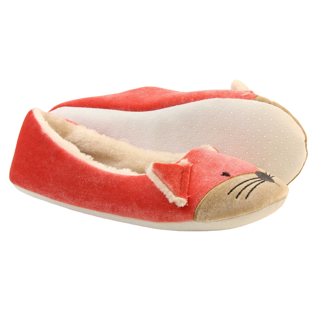 Fox slippers womens. Ladies slippers in a ballerina style. With red velvety upper, cute embroidered fox face and matching ears. White faux fur lining. Beige textile sole with bumps to the bottom for grip. Both feet from a side profile with the left foot on its side to show the sole.