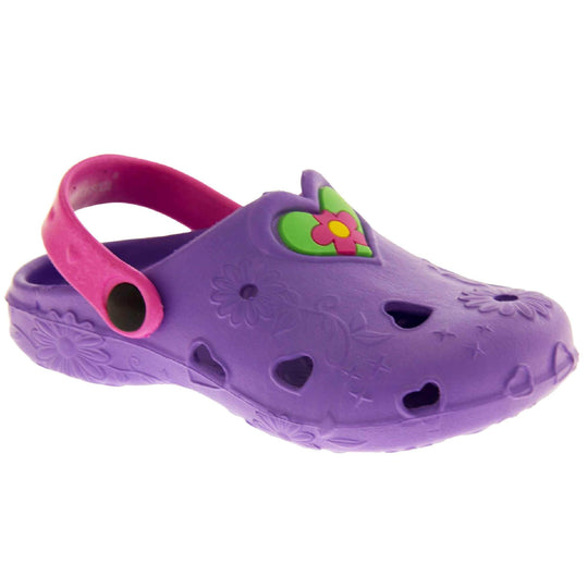Girls Beach Shoes. Purple synthetic clog style shoes with embossed flowers and stars. Cut out love hearts and centre of flowers on the upper. Green love heart, with pink and yellow flower in the centre, to the middle top of the upper. Pink strap that goes along the back of your heel. The strap can be moved along the top of the shoe instead to make the shoe a mule. Rightt foot at an angle