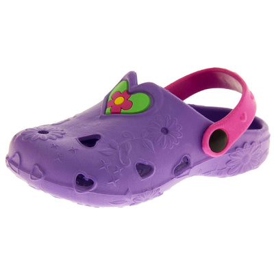 Girls Beach Shoes. Purple synthetic clog style shoes with embossed flowers and stars. Cut out love hearts and centre of flowers on the upper. Green love heart, with pink and yellow flower in the centre, to the middle top of the upper. Pink strap that goes along the back of your heel. The strap can be moved along the top of the shoe instead to make the shoe a mule. Left foot at an angle 