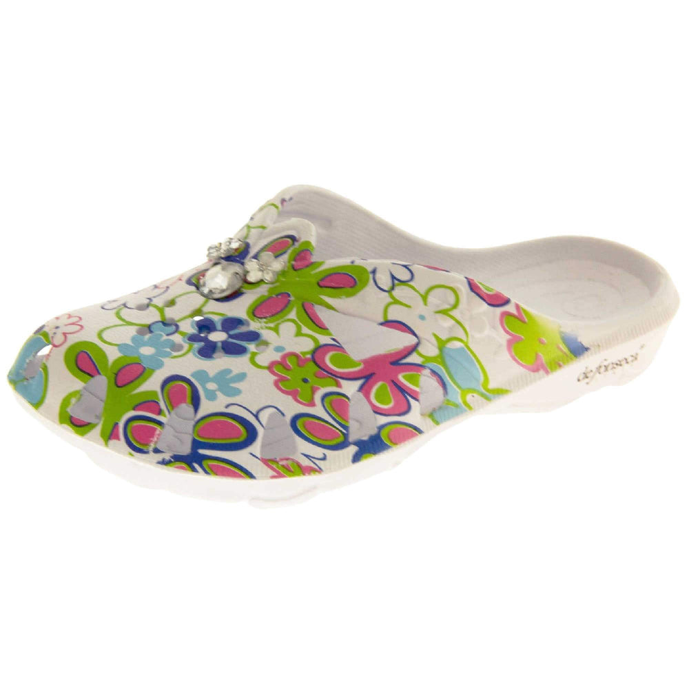 Girls Clogs. White synthetic clogs in a mule style. Cut out holes around the toes and the upper. Bright, fun floral print on the upper with diamante detailing to the centre. Matching white sole. Left foot at an angle.