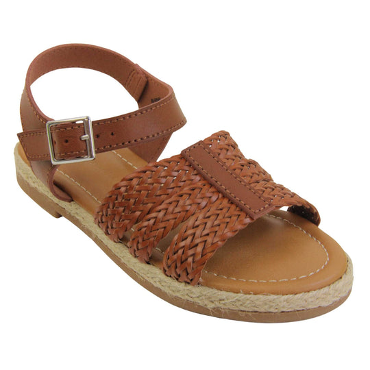 Girls flat sandals. Triple strap sandals with a faux leather dark brown upper. Three woven faux leather straps over the foot with a plain band down the middle. A plain ankle strap with silver buckle. Brown insole with brown lining. Brown outsole with jute rope style rim around the outside. Right foot at an angle.
