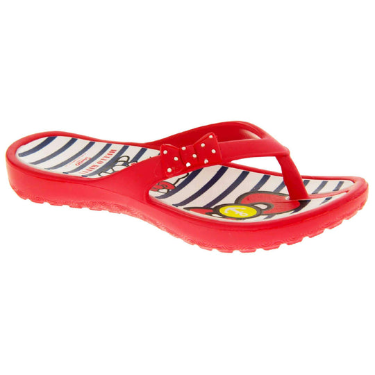 Girls flip flop. Hello Kitty flip flop with red sole and straps in a toe-post design with small red bow with white spots on. White and navy striped insole with Hello Kitty design on. Right foot at a slight angle.