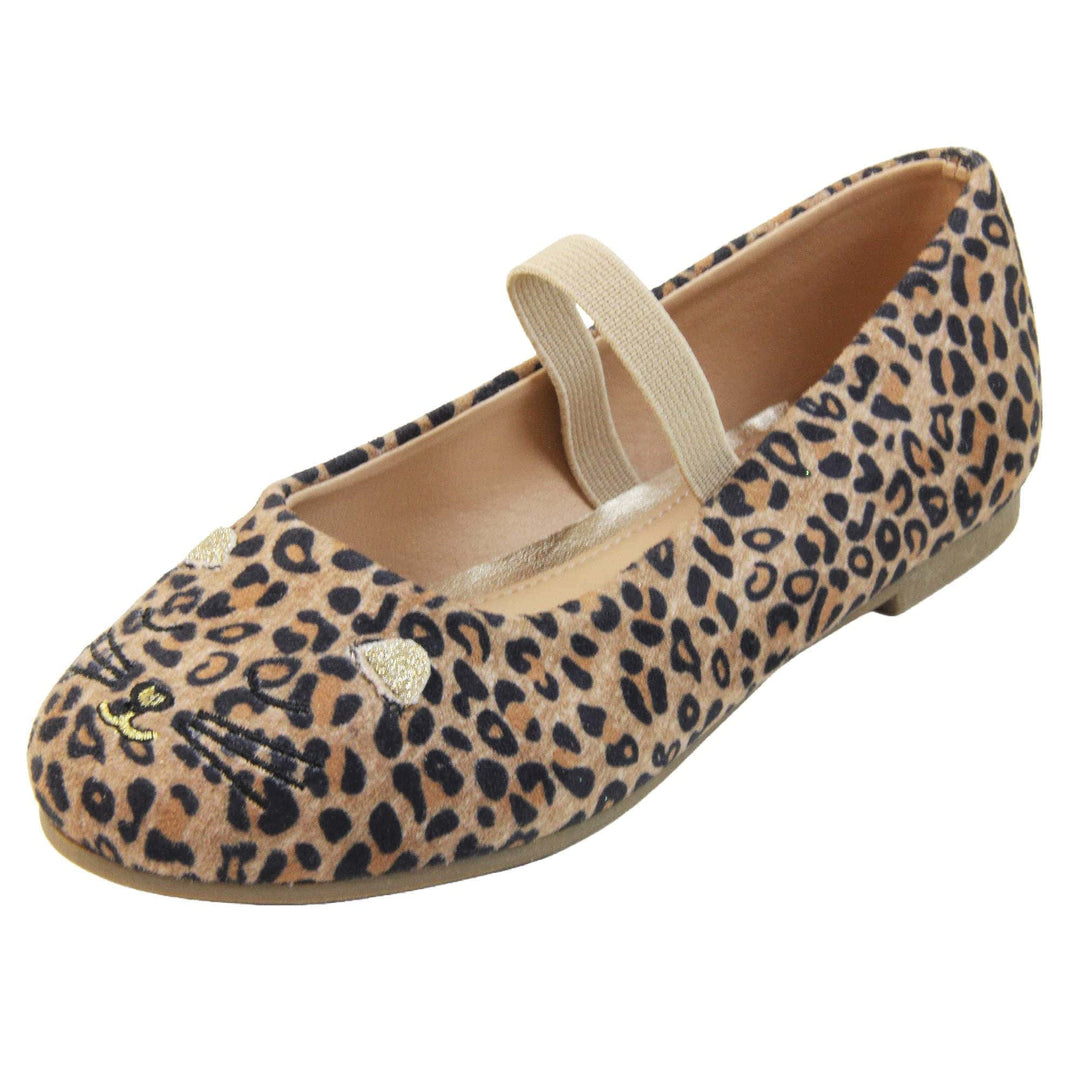 Girls leopard shoes. Ballerina style shoes with leopard print faux suede uppers and embroidered cat face to the front. With a beige elasticated over the foot strap. Beige lining and dark brown sole with very slight heel. Left foot at an angle.