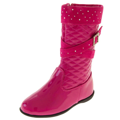 Girls pink boots. Fuchsia patent leather effect uppers with ankle upwards being a quilted style. With faux suede cuff and straps  that both have diamantes on. Diamante buckle on the straps. Zip fastening to the inside leg. Black synthetic sole. Left foot at an angle.