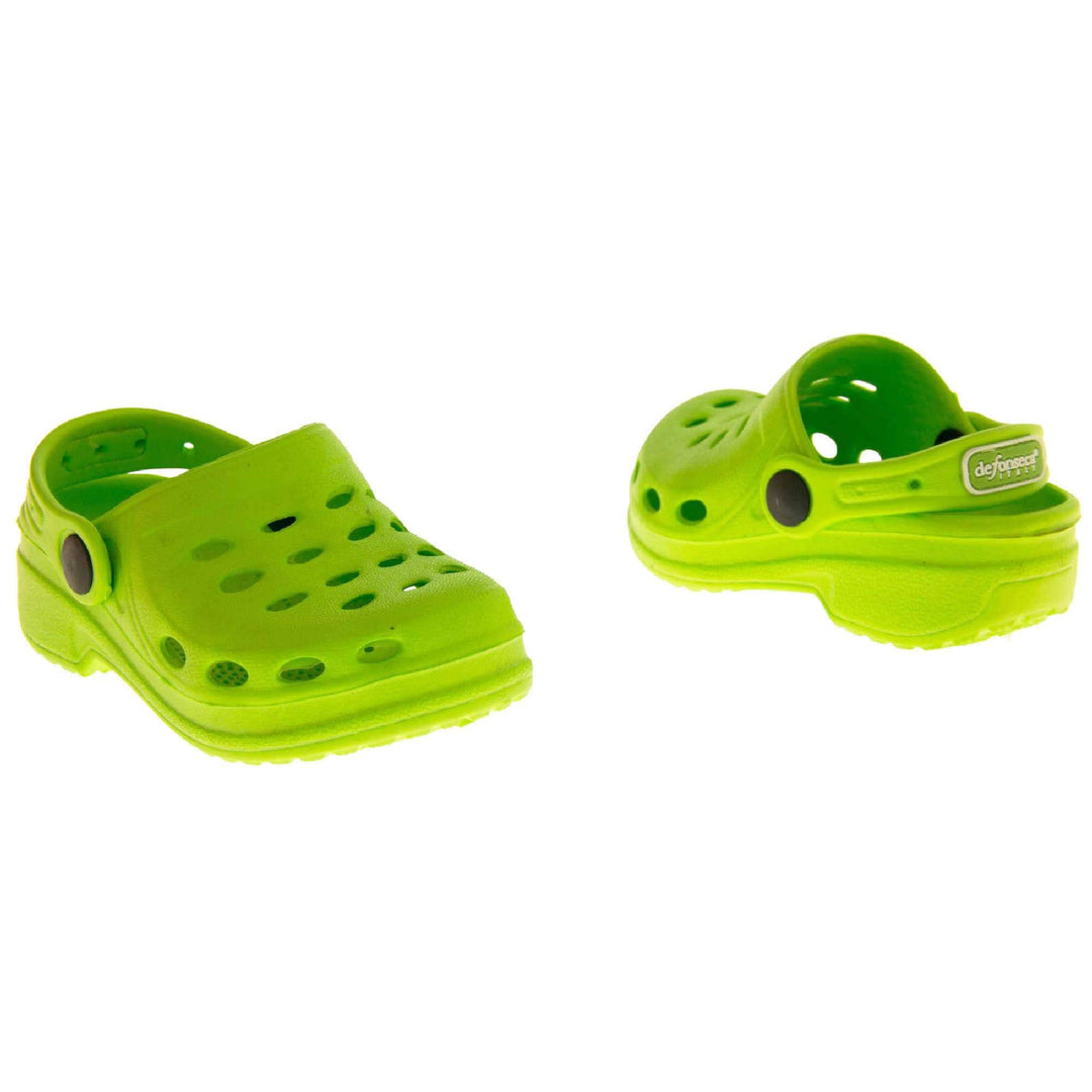Girls Pool Shoes. Lime Green synthetic clog style shoes. Cut out holes around the toes and the upper. Green strap that goes along the back of your heel. The strap can be moved along the top of the shoe instead to make the shoe a mule. Both shoes at a slight angle facing top to tail.