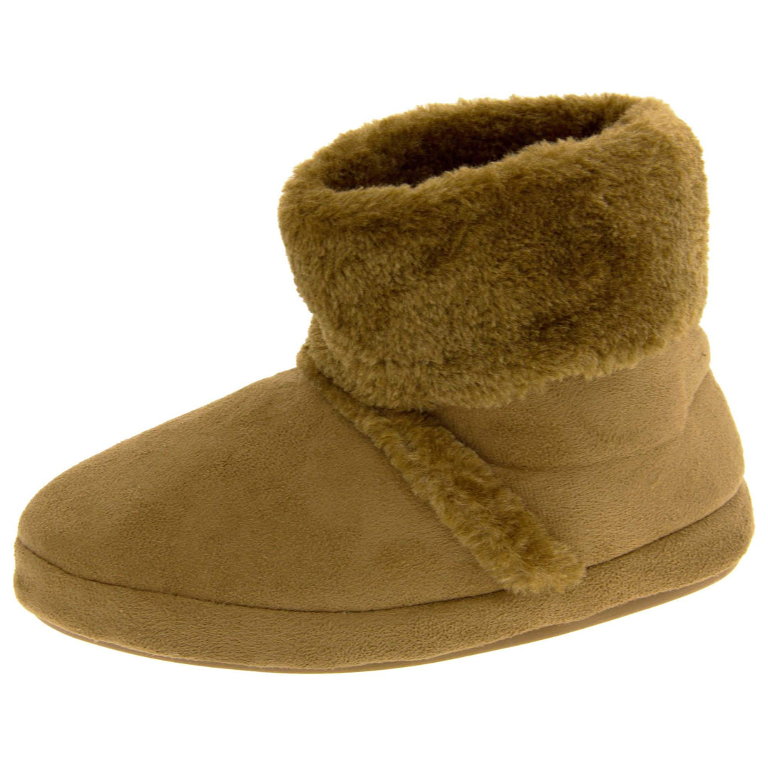 Girls Winter Boot Slippers. Brown faux suede boot style slippers with matching brown faux fur collar and lining. Also has a line of brown faux fur along the ridge of the foot on the upper. Firm sole with wavy lines for grip in the same brown colour. Left foot at an angle.