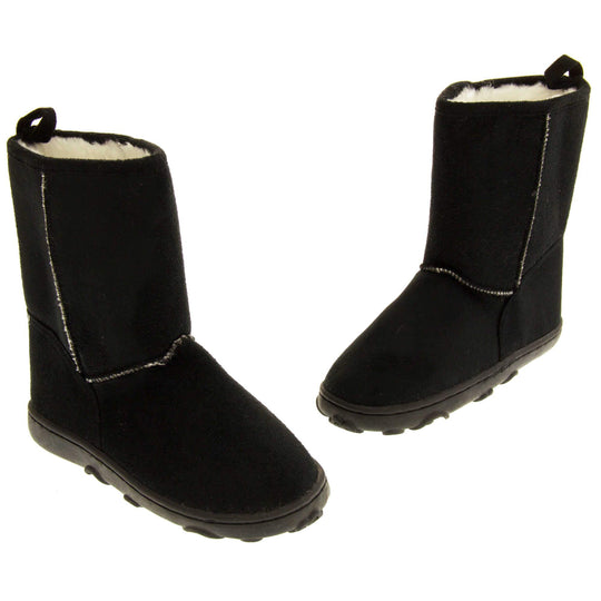Girls winter boots - Black faux suede boots with visible stich detailing, Black sole with raised slip resistant grip and cream faux fur lining. Both boots at an angle toes pointing in a v