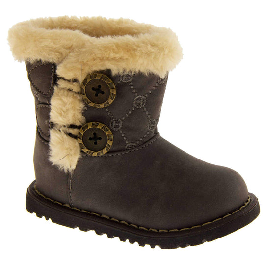 Girls Winter Boot Infant Sizes. Grey faux suede with chunky black sole and cream fur trim around rim and down the side of the boot. 2 buttons on the side with the fax fur as detailing. Right foot at an angle.