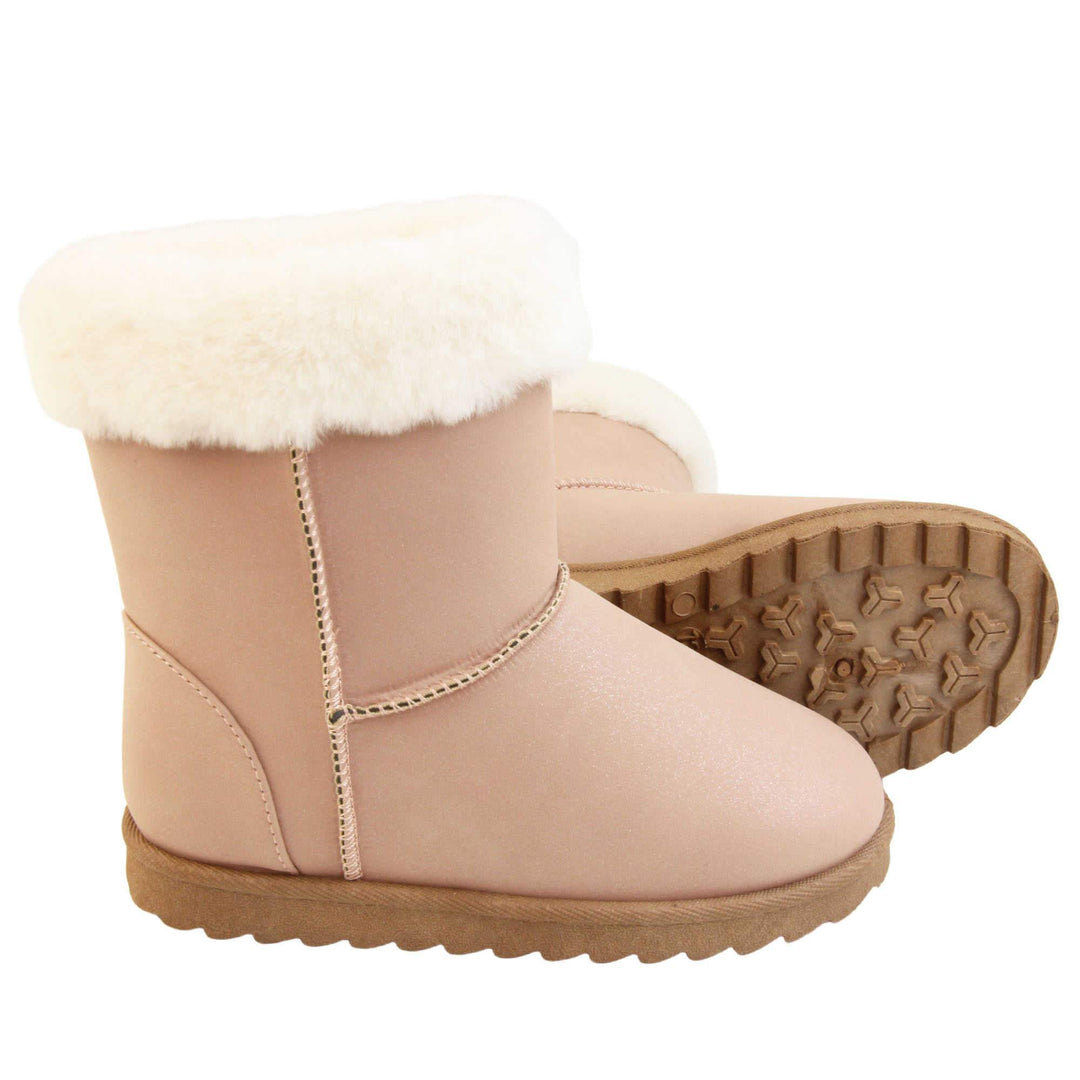 Girls Winter Boots - Pink shimmery glitter boots with visible stitching detailing, white fur cuff and brown chunky durable sole. Both feet with outsole showing.