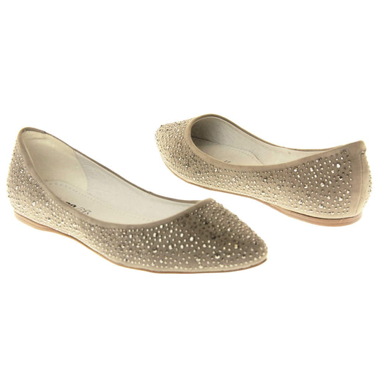 Gold flat pumps. Ballet style shoes with a taupe faux suede upper covered in gold diamantes. Cream leather lining and beige sole. Both feet at an angle facing top to tail.