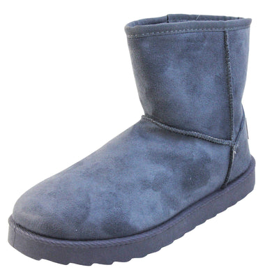 Grey ankle boots flat. Ankle boots with a grey faux suede upper and stitching detail. Grey faux fur lining. Chunky grey sole with deep tread to the bottom. Left foot at an angle.