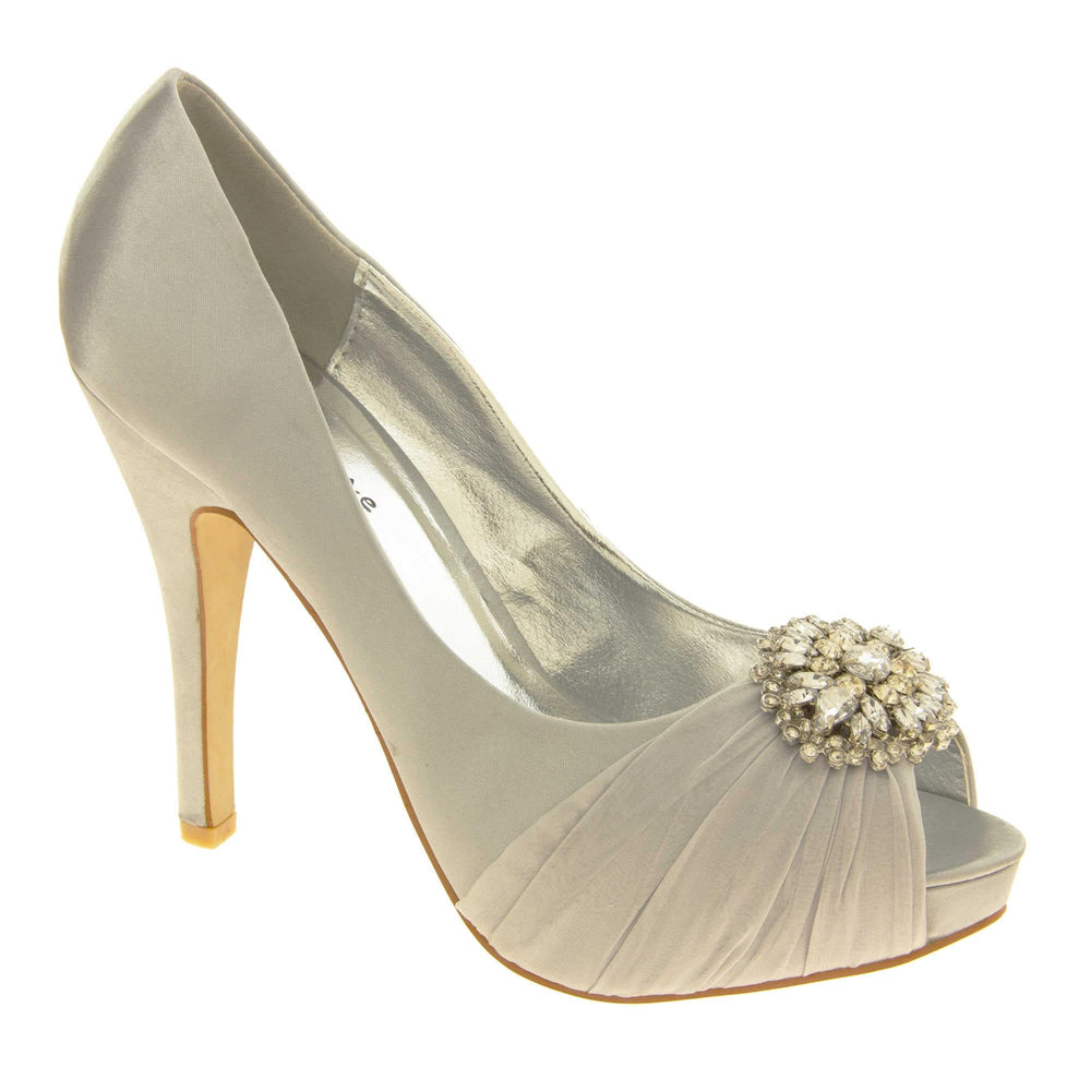 Grey satin heels. Classic women's peep toe high heels with a pale grey satin upper. Metallic silver insole with Sabatine branding. Grey satin stiletto heel with a cream sole. Diamante cluster and ruched detailing across the toes. Right foot at an angle.
