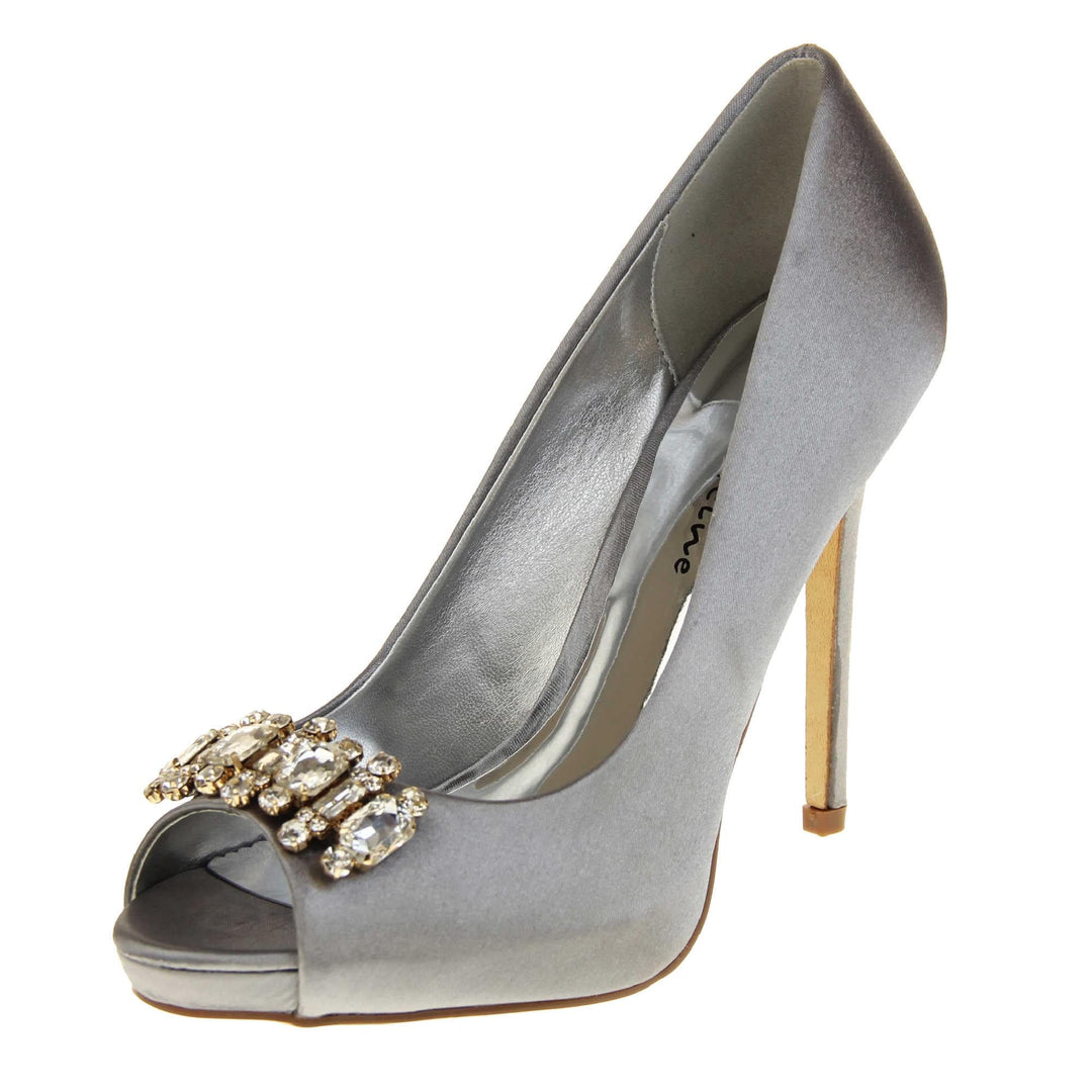 Grey satin shoes. Classic women's peep toe high heels with a grey satin upper. Metallic silver insole with Sabatine branding. Grey satin stiletto heel with a cream sole. Diamante cluster detailing across the toes. Left foot at an angle.