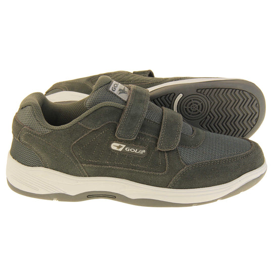 Men's grey wide fit trainers. Classic trainer style in wide fit with grey coated leather upper and grey stitching detail. Two grey touch fasten straps with grey tongue and textile lining. Grey and white Gola branding to the side. White outsole with grey base. Both feet from a side profile with the left foot on its side to show the sole.