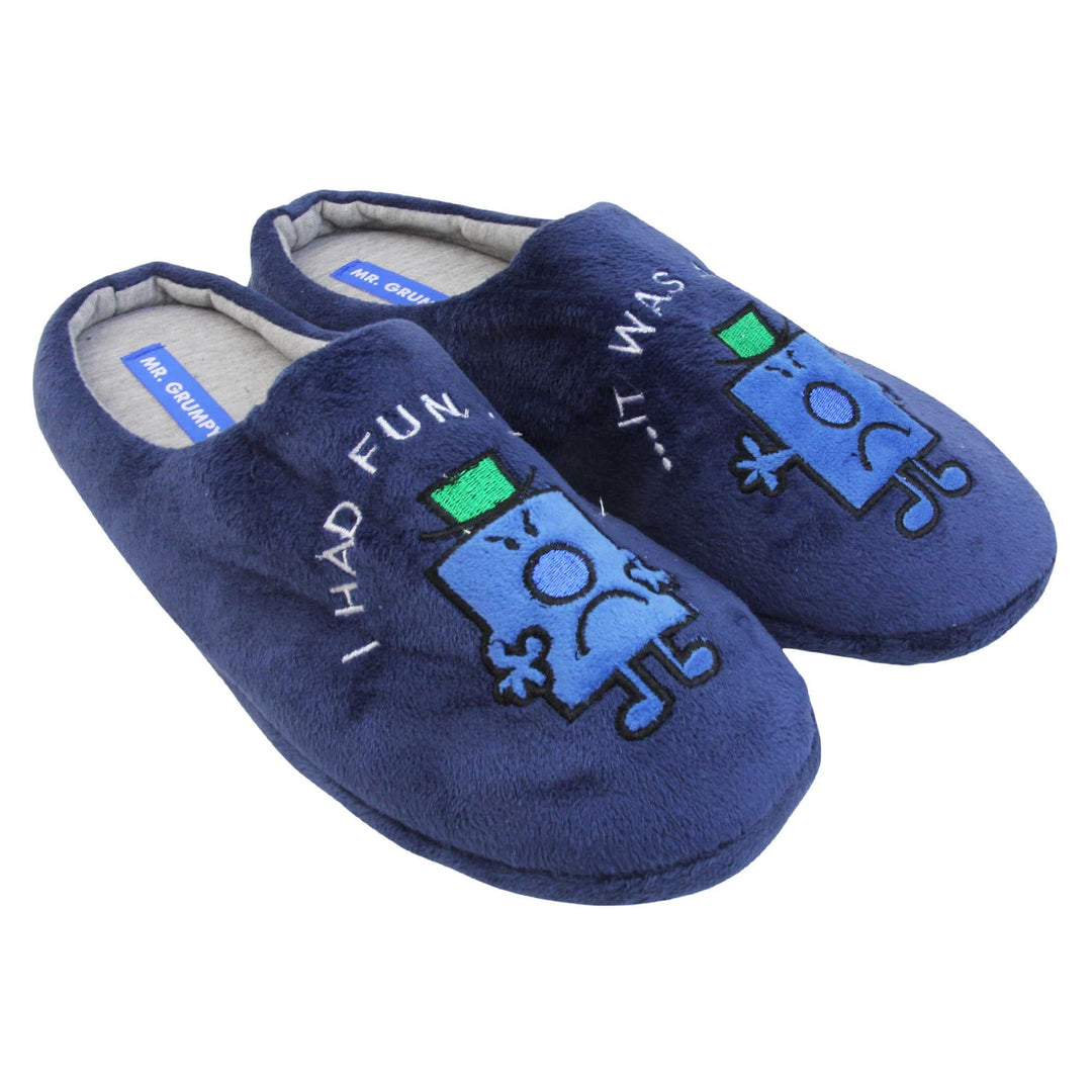 Grumpy slippers. Mule style slippers with soft navy blue uppers. An embroidered Mr grumpy figure on the front with the words 'I had fun' on one and 'it was awful' on the other embroidered above it. Grey textile lining with firm black sole. Both feet together at an angle.