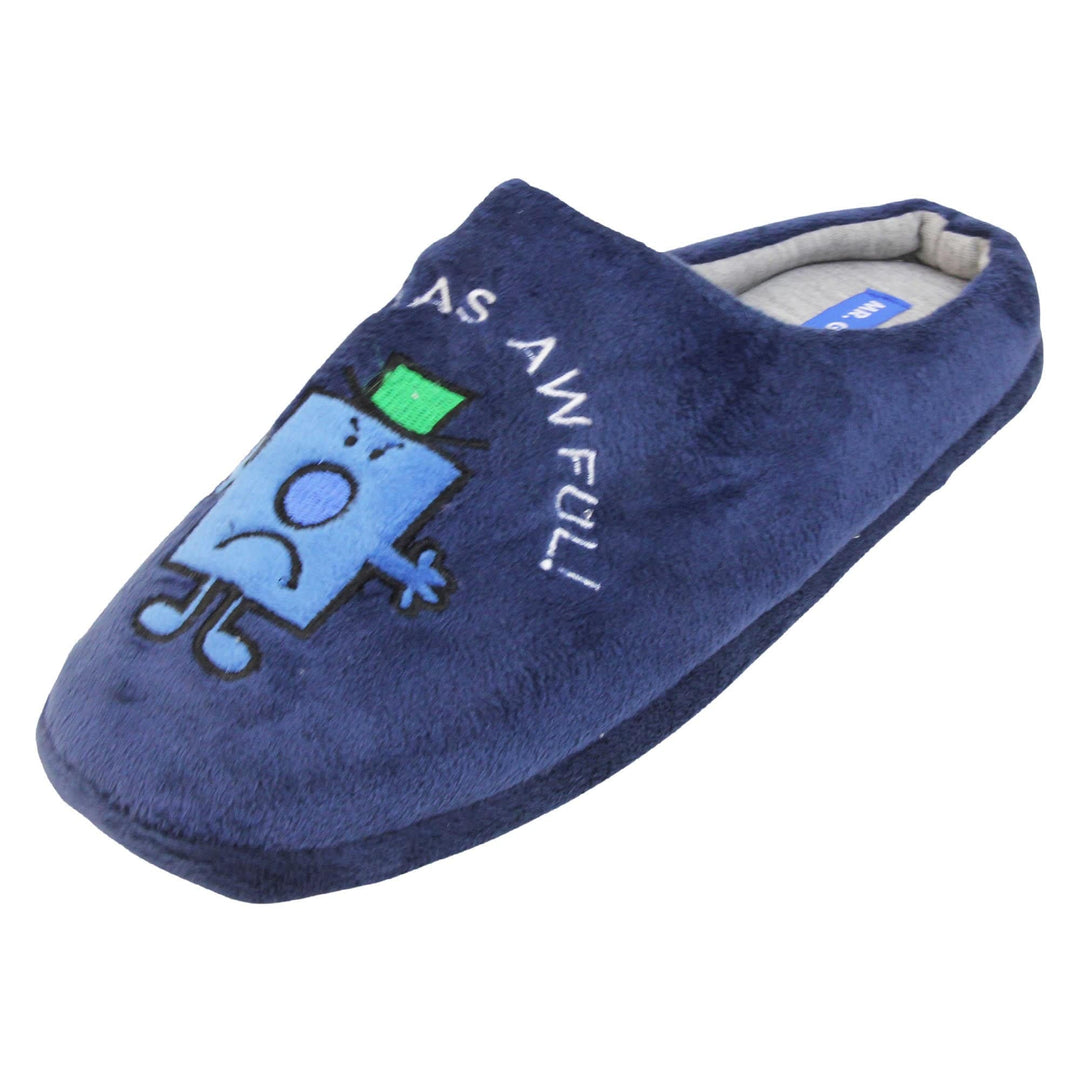 Grumpy slippers. Mule style slippers with soft navy blue uppers. An embroidered Mr grumpy figure on the front with the words 'it was awful' embroidered above it. Grey textile lining with firm black sole. Left foot at an angle.