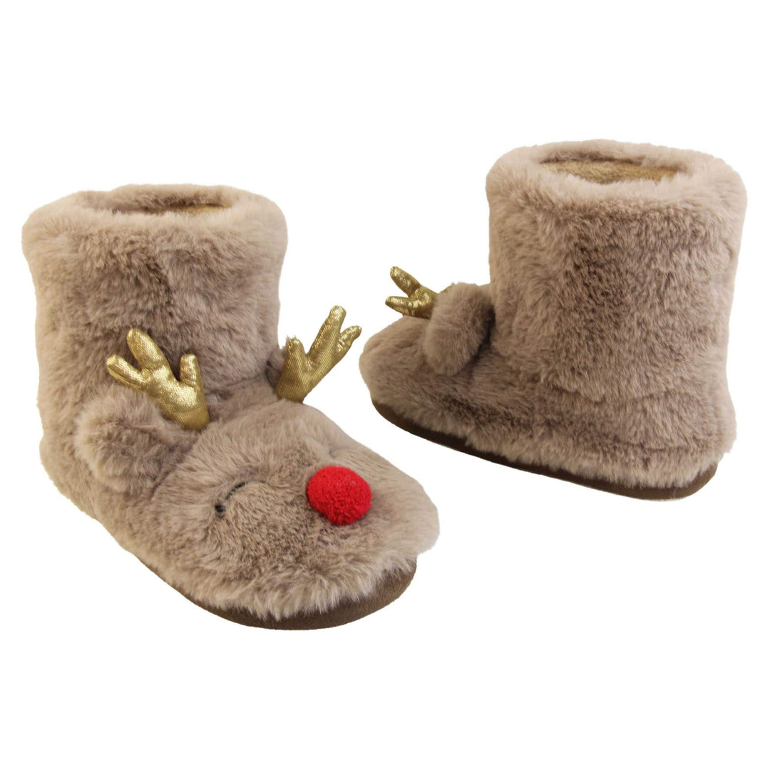 Kids animal slippers. Furry slipper boots in a brown faux fur with a cute reindeer face on. With a red pom pom nose and gold shiny antlers. The same colour fleece lines the boot. Both feet from a slight angle facing top to tail.