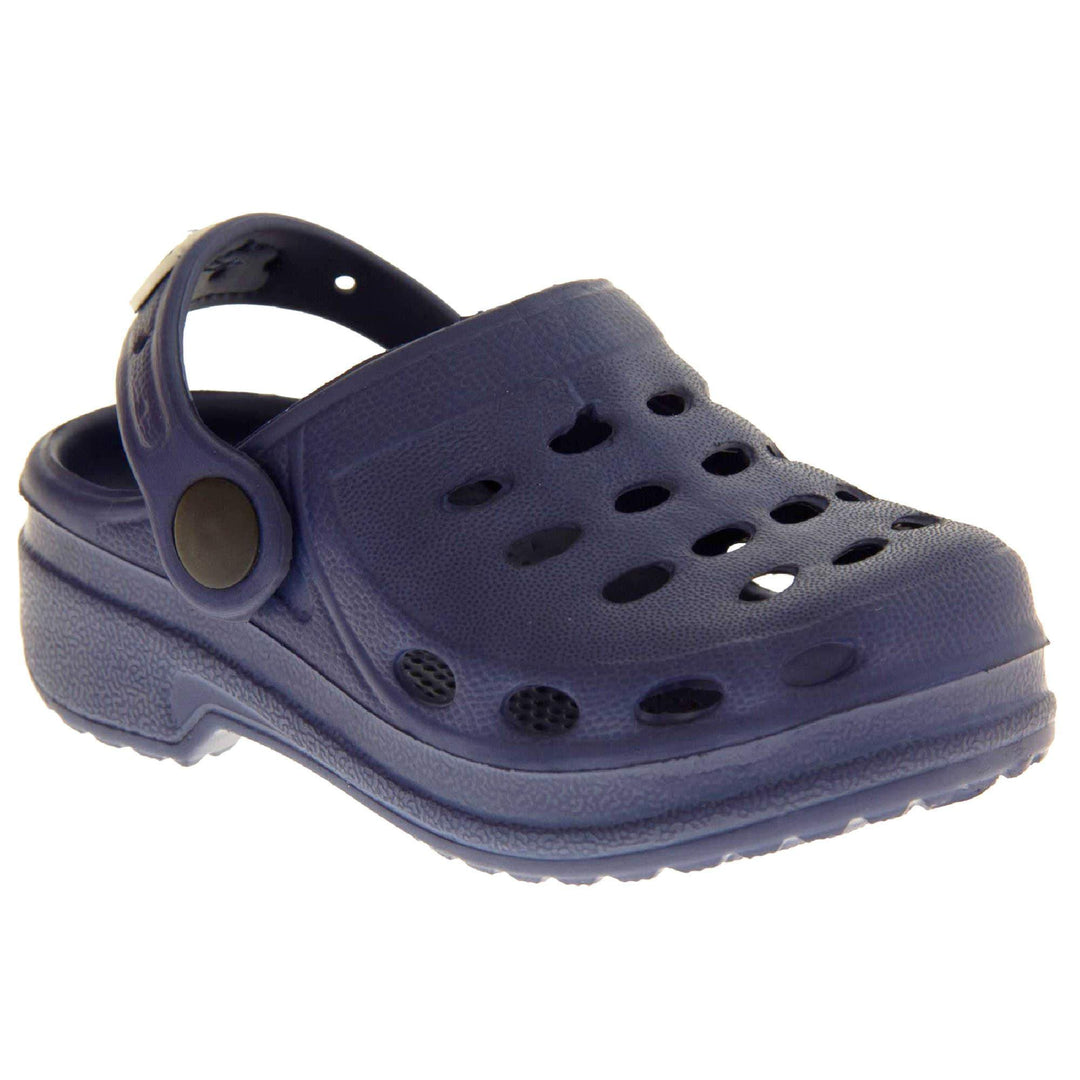 Kids Pool Shoes. Navy Blue synthetic clog style shoes. Cut out holes around the toes and the upper. Navy strap that goes along the back of your heel. The strap can be moved along the top of the shoe instead to make the shoe a mule. Right foot at an angle