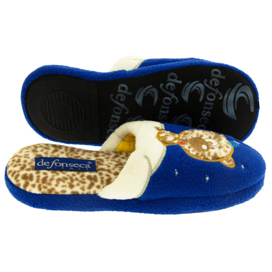 Kids cat slipper. Mule slipper with royal blue upper. Cream trim to the top of the upper, along the bridge of the foot. With an embroidered leopard print cat sat on the trim with a little blue night cap on and stars around him. The insole of the slipper is leopard print with a blue De Fonesca label on it. With a black sole. Both feet from side profile with the left foot on its side to show the sole.