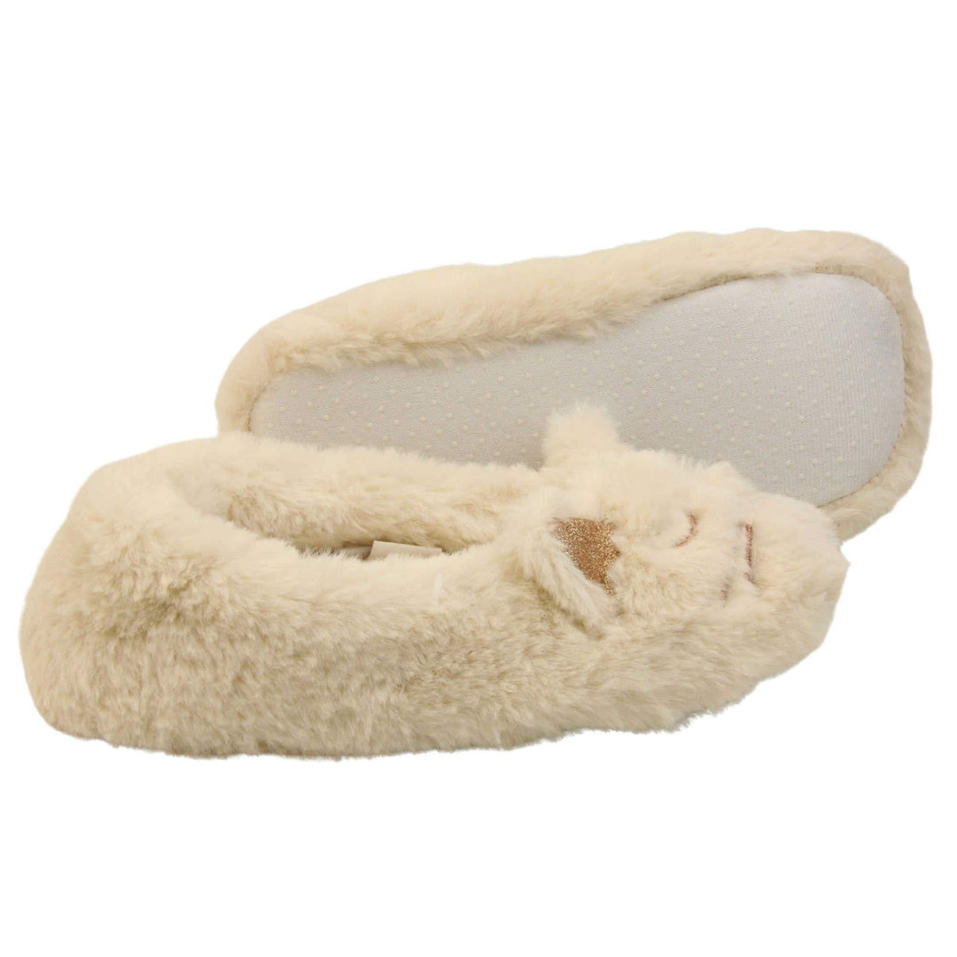 Kids cat slippers. Cream faux fur ballet style slipper with cat face stitched into the upper. Sparkly ear detail to the top of the upper. Lined with the same faux fur. Both feet from a side profile with the left foot on its side to show the sole.