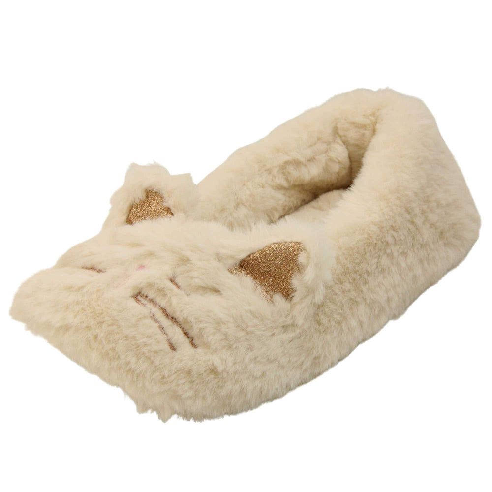 Kids cat slippers. Cream faux fur ballet style slipper with cat face stitched into the upper. Sparkly ear detail to the top of the upper. Lined with the same faux fur. Left foot at an angle.