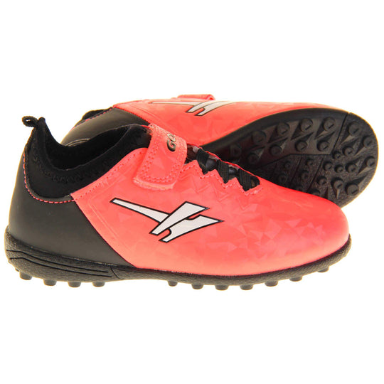 Kids football boots. Metallic red Gola boots with white Gola logo to the sides. With black heel, tongue and black elastic lace detail to the front. Red touch close strap with Gola branding across it. Black bumpy sole. Both feet from side profile with the left foot on its side to show the base of the shoe.