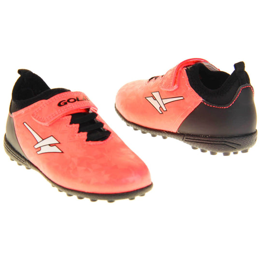 Kids football boots. Metallic red Gola boots with white Gola logo to the sides. With black heel, tongue and black elastic lace detail to the front. Red touch close strap with Gola branding across it. Black bumpy sole. Both shoes facing top to tale.