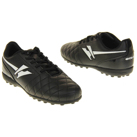 Astro turf boots. Black football trainers with stitching detail to the toes to give a quilted appearance. The black lace fastening to the front. White Gola logo to the side and white Gola branding to the tongue. Black sole with small Astro turf bumps to the base. Both feet facing top to tale from an angle.