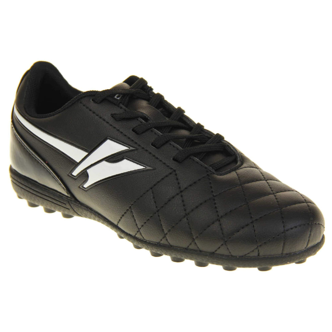 Astro turf boots. Black football trainers with stitching detail to the toes to give a quilted appearance. The black lace fastening to the front. White Gola logo to the side and white Gola branding to the tongue. Black sole with small Astro turf bumps to the base. Right foot at an angle.