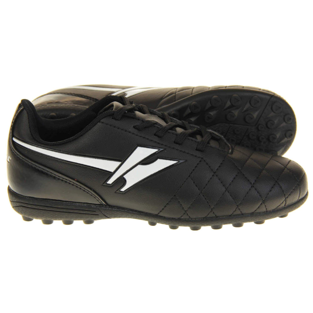 Astro turf boots. Black football trainers with stitching detail to the toes to give a quilted appearance. The black lace fastening to the front. White Gola logo to the side and white Gola branding to the tongue. Black sole with small Astro turf bumps to the base. Both feet from side profile with the left foot on its side to show the sole.