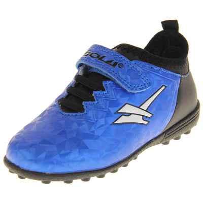 Kids football trainers. Metallic cerulean blue Gola boots with white Gola logo to the sides. With black heel and tongue and black elastic lace detail to the front. Metallic blue touch close strap with Gola branding across it. Black soles with small Astroturf studs. Left foot at an angle