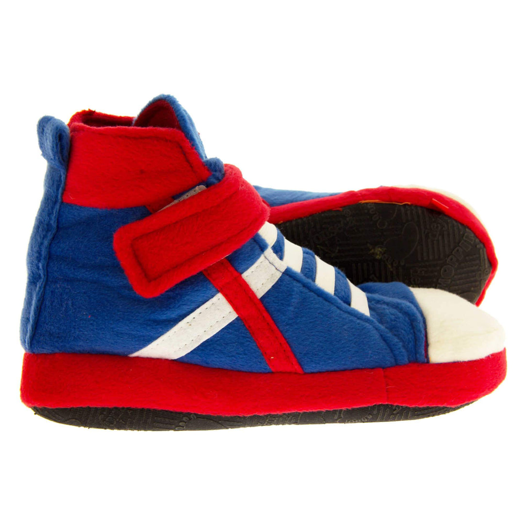 Kids High Tops Slippers. Slippers that look like high top trainers. Soft royal blue upper with white toes and elastic faux laces. White diagonal stripe on the side of the upper. Red touch fasten ankle strap and collar. Red line runs in a diagonal line to the sole. Forms a x with the white line. Thick red edging around the sole. Black sole to the bottom. Both feet from side profile with left foot on its side to show the sole.