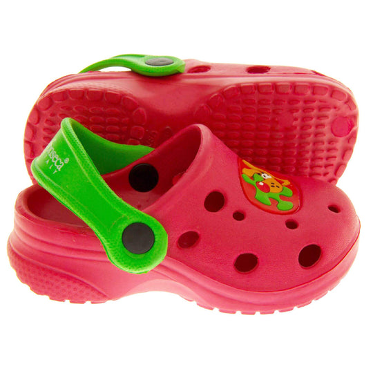 Kids Summer Clogs. Red synthetic clog style shoes. Cut out holes in the upper with a cartoon dog decal in the centre centre. Green strap that goes along the back of your heel. The strap can be moved along the top of the shoe instead to make the shoe a mule. Both feet from side profile with left foot on its side to show the sole.